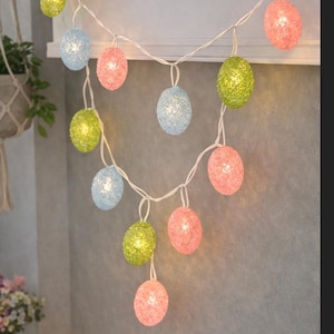 May include: A set of three ceramic mugs with a speckled, matte finish. The mugs are in shades of cream, light gray, and dark gray. Each mug has a simple, minimalist design, perfect for coffee or tea.