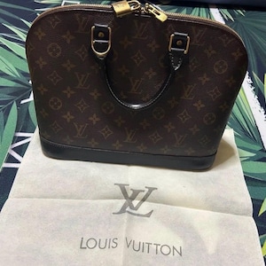 LOUIS VUITTON Sac à main Alma en cuir et toile à monogramme M51130 Marron
