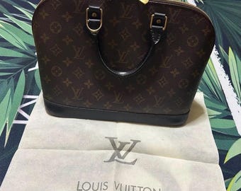 Bolso de mano LOUIS VUITTON Alma Monogram de piel y lona, modelo M51130, color marrón.
