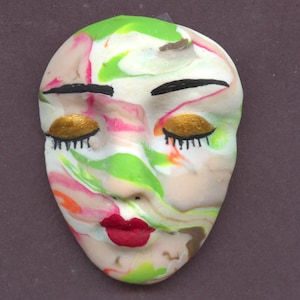 May include: A white ceramic mug with a black handle and the text "But First, Coffee" in a bold, black font. The mug is set against a neutral background, highlighting its simple design.