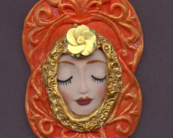 A OOAK  Larger  Polymer Clay Tangerine textured   base with a detailed Doll Face    2 " x  3"   A 41