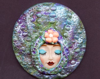 A OOAK  Larger  Polymer Clay multi colored  and pearl  base with a detailed Doll Face     3" x  3"   A 42