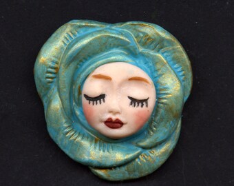Polymer Clay Face in Rose Cab  Turquoise with gold 1 1/2" x 1 1/2"   ADR 5