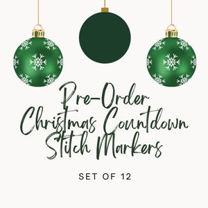May include: A set of 12 stitch markers featuring green Christmas ornaments with white snowflake patterns and one solid dark green ornament. The text reads Pre-Order Christmas Countdown Stitch Markers SET OF 12 in a dark green script and sans-serif font.