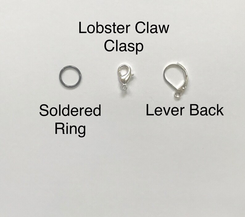 May include: Three different types of jewelry clasps: a lobster claw clasp, a soldered ring, and a lever back clasp.