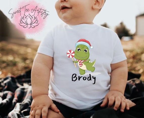 Personalized Kid's Christmas Dinosaur Shirt - Custom Name Holiday Clothing - Adorable Christmas Dino for Kids - Customizable Font Colors