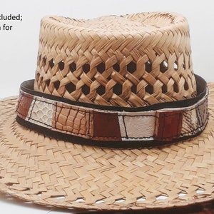 May include: A brown woven straw hat with a black leather band and a multi-colored leather patch. (hat not included; only shown for example...)