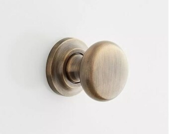 New 1-1/4" Antique Brass Brass Round Knob with Beveled Round Base Plate by Signature Hardware