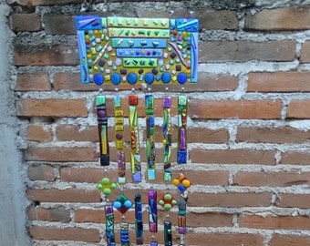 Sample of a Wind Chime or wall hanging design. available in yellow, blue, green or red, solid or clear backgrounds with  dichroic glass