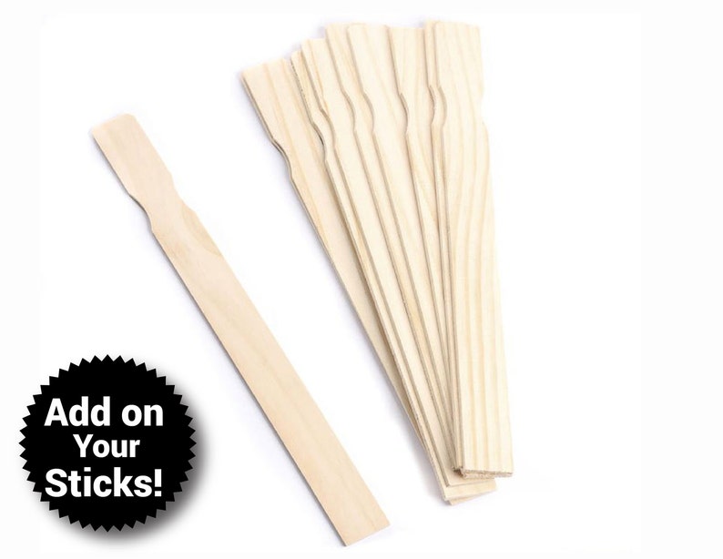 May include: A bundle of 10 wooden craft sticks, each approximately 6 inches long, with a rounded end and a flat, slightly wider end. The sticks are arranged in a fan shape, with the rounded ends facing outward. The sticks are a natural wood color.