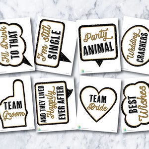 May include: Set of 10 black and gold photo booth props with various wedding-themed phrases, including "I'm still single", "Team Groom", "Happily Ever After", "Party Animal", and "Wedding Crashers".
