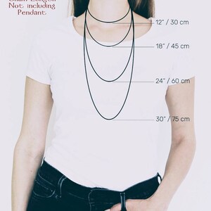 May include: A model wearing a white shirt and jeans shows different chain lengths for necklaces. The lengths are 12 inches/30 cm, 18 inches/45 cm, 24 inches/60 cm, and 30 inches/75 cm.