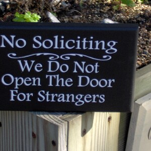 No Soliciting We Do Not Open The Door For Strangers Wood Sign for wall or door.  9" x 5.5" - color options as well as different display methods are available.