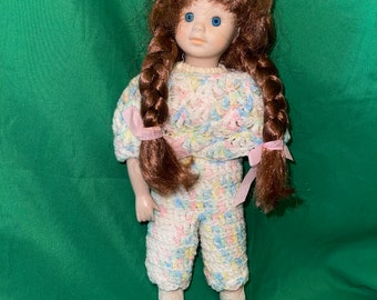 vintage porcelain girl doll with auburn hair ,two braids, blue eyes