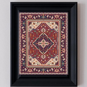 May include: A framed print featuring a detailed, ornate rug design. The rug has a deep red central field with a complex pattern in shades of blue, cream, and green. The frame is a simple, solid black, providing a clean border for the artwork.
