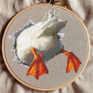 May include: A white ceramic mug with a black handle and the text "But First, Coffee" in a black, handwritten-style font. The mug is on a white surface.