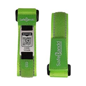 May include: A green wristband with a black strap and a silver tag that says "SafeBandd" and has a QR code and the text "SCAN ME" and "CODE: 123456".