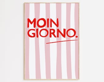 Puede incluir: Un cuadro enmarcado con un fondo de rayas rosas y blancas. El texto rojo en negrita dice "MOIN GIORNO." Una línea roja subraya el texto. La obra de arte está en un marco de madera clara.