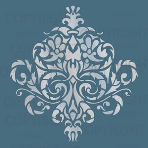 May include: A white damask pattern stencil for crafting and decorating projects. The stencil features a symmetrical design with intricate details.