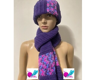 May include: Purple crocheted hat and matching scarf with pink and blue accents. The hat has a checkered pattern on the side.