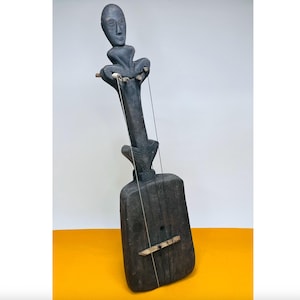 Zande or Mangbetu Harp with Carved Figure. Congo. 20th Century.