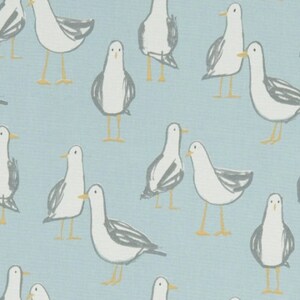 May include: A light blue background with a repeating pattern of white seagulls with grey markings. The seagulls are in various positions, some facing left, some facing right, and some facing forward. The seagulls have yellow beaks and feet.