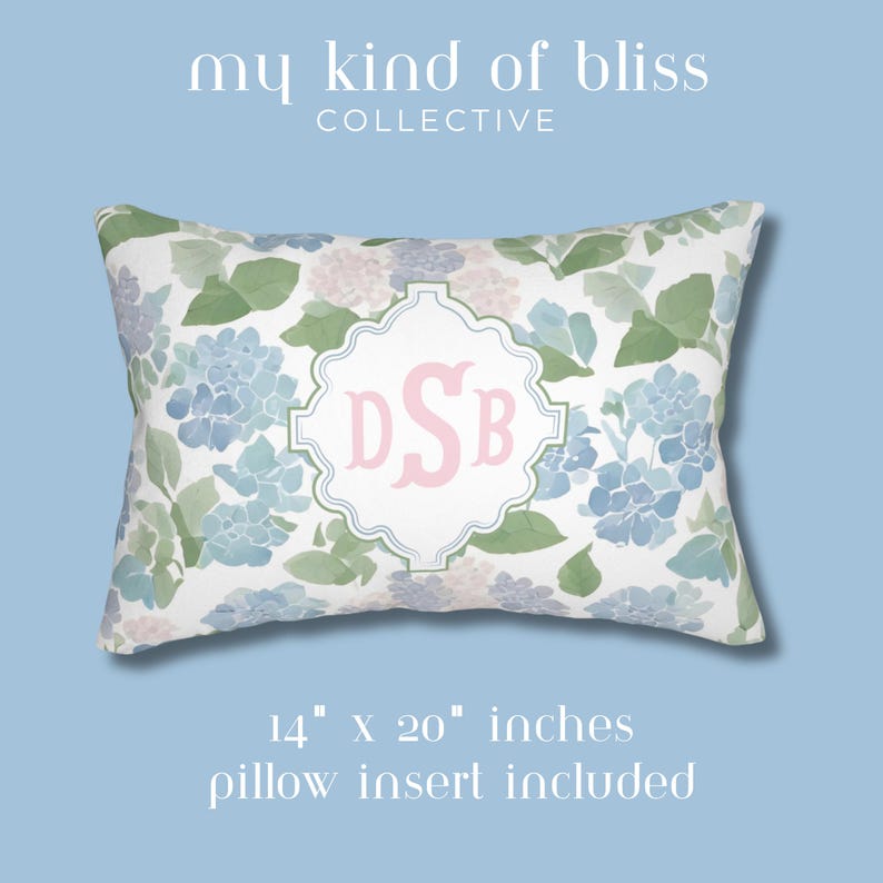 Front and back view of personalized hydrangea lumbar pillow with floral print and custom monogram design in pastel blue and pink.
