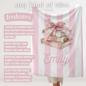 My Custom Name Book Lover Coquette Blanket. Featuring a pink and white striped background with a watercolor book stack wrapped in a bow, this plush blanket is as cozy as it is cute. Add your custom name underneath for a personalized, preppy, coquette touch. Perfect for book lovers, girls bedrooms, baby showers, newborns, or a stylish preppy touch to dorm