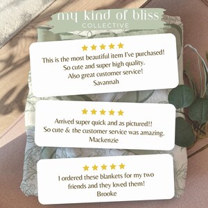 May include: The image showcases a folded blanket with a floral pattern in shades of green and white. Three white rectangular cards with customer reviews are overlaid on the blanket. The text on the cards includes customer testimonials and the brand name "my kind of bliss COLLECTIVE."