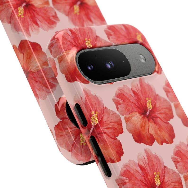 This phone case features a tropical collage pattern of red watercolour hibiscus flowers on a soft pink background. Perfect for coconut girls and beach lovers. Available for iPhone, Samsung and Pixel Phones. Summer Phone Case.