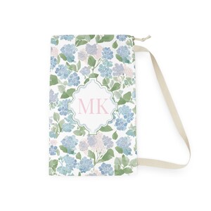 Flat product image
Flat lay personalized hydrangea floral laundry bag with shoulder strap and monogram initials, custom dorm move in gift