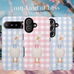 May include: Three phone cases with a gingham pattern in pink and blue. Each case features a watercolor illustration of a white goose with a bow. The names "Lillie", "Sarah", and "Emily" are written below each goose. The text "my kind of bliss COLLECTIVE" is at the top.