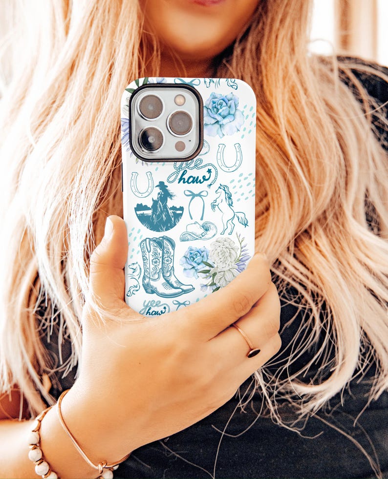 Coastal Coquette Cowgirl Phone Case. Featuring a collage of western inspired elements in shades of white and blue, mixed with some coquette style bows and flowers. The background is white and the colour palette is coastal and calm. For iPhone, Samsung & Pixel