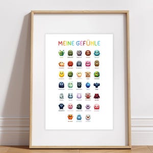 May include: A colorful poster with the title "Meine Gef&uuml;hle" (My Feelings) in German. It features a grid of 36 cartoon monsters, each representing a different emotion. The monsters are drawn in a variety of colors and styles, with each one having a unique expression.