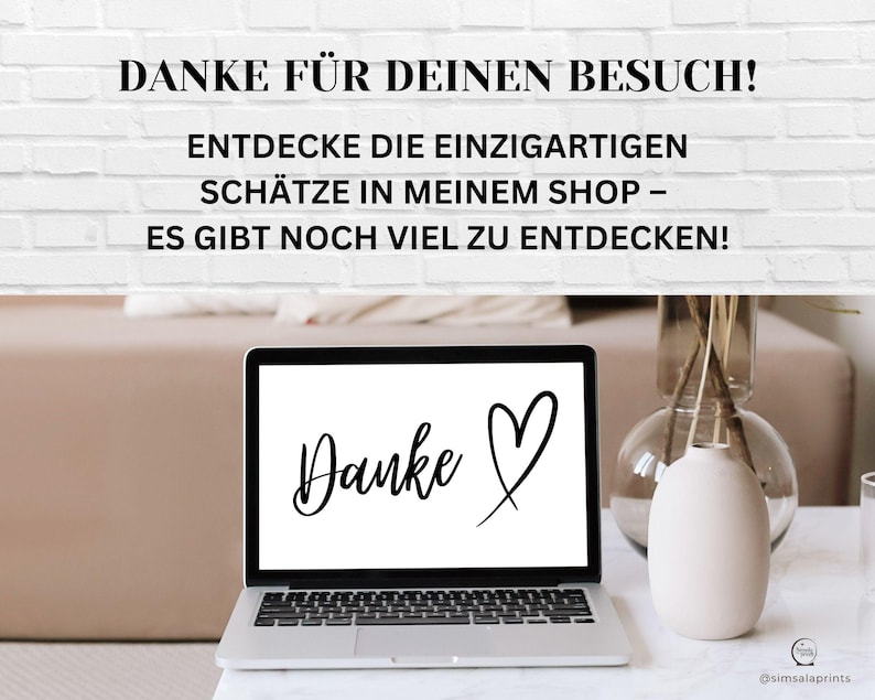 May include: A laptop computer with a white background and the text "Danke" with a heart drawn next to it. The laptop is on a white table with a vase of dried flowers and a glass of water.
