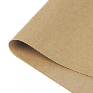 May include: A sheet of brown craft paper, folded in half, with a textured surface.