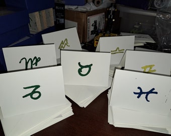 5 mix and match hand-cut and -printed linocut zodiac greeting cards