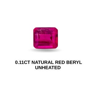 May include: A vibrant, rectangular-cut, natural red beryl gemstone. The gem is a deep pinkish-red color and is labeled as 0.11CT, unheated. The gemstone is set against a white background.