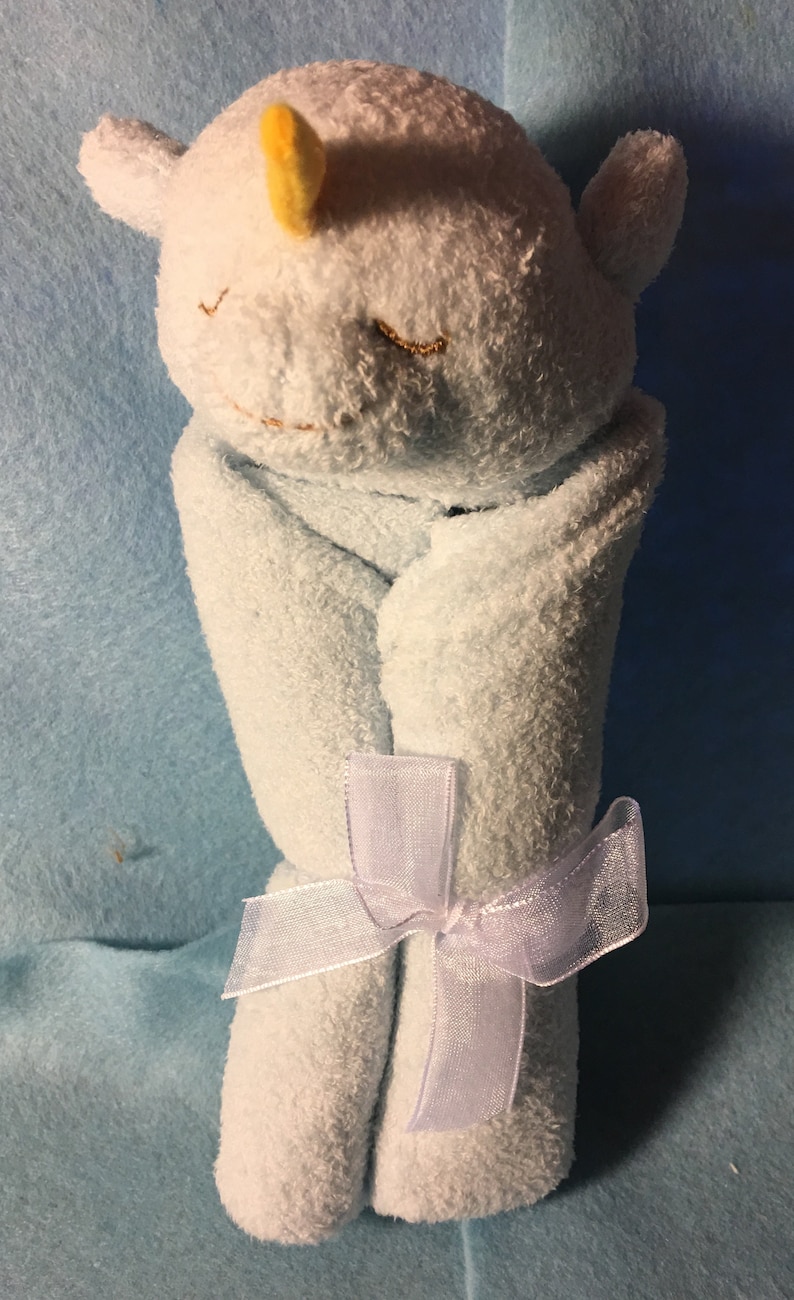 May include: A set of three ceramic mugs with a speckled, matte finish. The mugs are in shades of cream, light grey, and dark grey. Each mug has a simple, modern design and a comfortable handle. Ideal for tea or coffee.