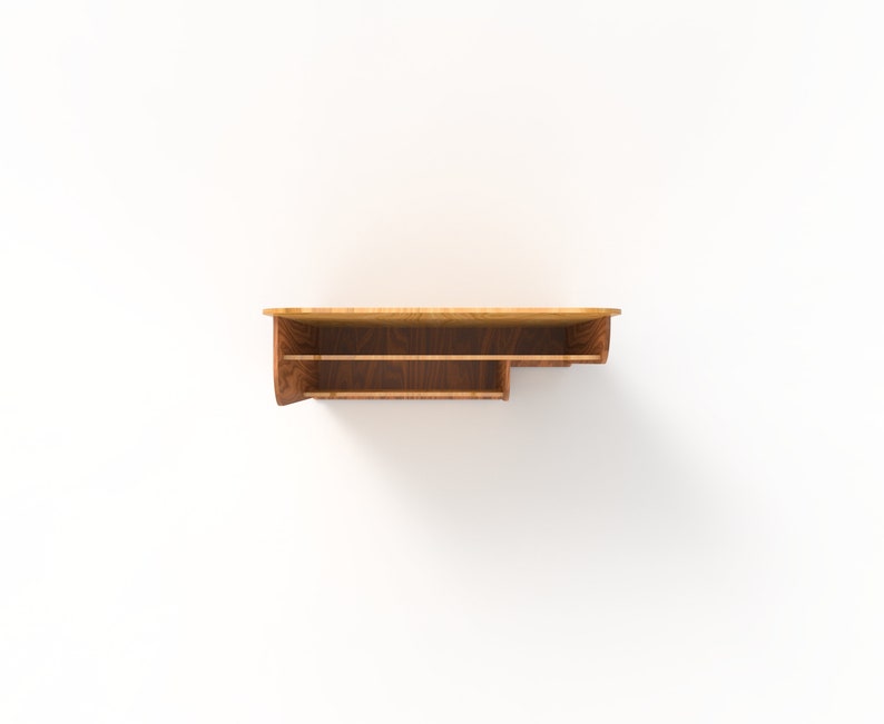 Peut inclure: Une &eacute;tag&egrave;re murale en bois avec deux &eacute;tag&egrave;res. L'&eacute;tag&egrave;re est en bois brun clair avec une teinte brun fonc&eacute;. L'&eacute;tag&egrave;re est fix&eacute;e &agrave; un mur blanc.