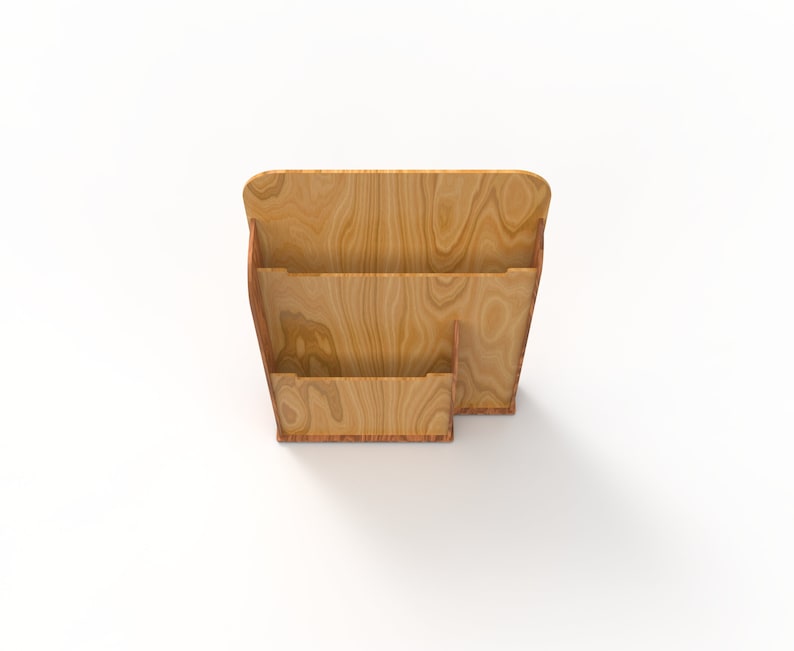 Peut inclure: Un porte-revues en bois avec trois compartiments. Le porte-revues est en bois brun clair avec un grain de bois naturel.