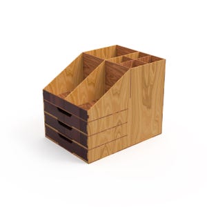 May include: A wooden desk organizer with multiple compartments and three drawers. The organizer is made of light-colored wood with darker wood accents on the drawers and dividers. The design is angled for easy access to the compartments.