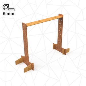 May include: A wooden stand with two vertical supports and a horizontal top shelf. The stand is made of light brown wood and has a simple design.