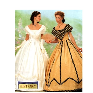 May include: Two floor-length gowns with wide necklines and full skirts. The left gown is white with fringe trim and long white gloves. The right gown is gold with black scalloped trim and a black collar. A logo reads MAKING HISTORY.