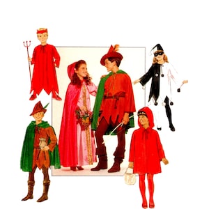 May include: A collection of children's costumes including a red devil outfit with a pitchfork, a pink dress with a red hooded cape, a green and brown forest adventurer outfit, a black and white jester costume, and a red hooded cape with red tights.