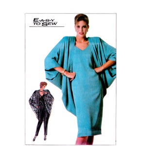May include: A sewing pattern envelope featuring the text E-A-S-Y TO SEW. The image displays a teal dress with a V-neckline and a matching oversized cape-style jacket with wide sleeves. A smaller illustration shows a patterned jacket and black trousers.