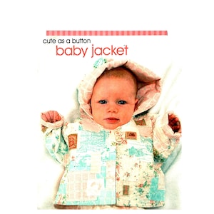 May include: A hooded baby jacket featuring a patchwork design with light blue, pink, and white floral and grid patterns. The text "cute as a button baby jacket" is printed at the top. The jacket has long sleeves and a hood with a pink checkered lining.