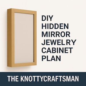 May include: A wooden-framed mirror with a light beige interior is mounted on a white wall. The frame has a natural wood grain. Text on the right side reads "DIY HIDDEN MIRROR JEWELRY CABINET PLAN". Below the text is "THE KNOTTYCRAFTSMAN".