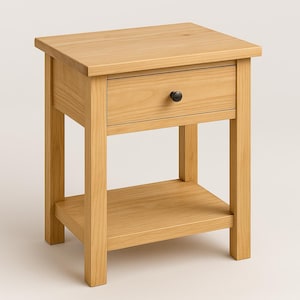 Puede incluir: Una mesita de noche de madera clara con un caj&oacute;n y un estante inferior. El caj&oacute;n tiene una perilla negra.