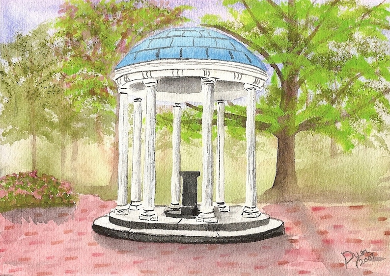 May include: A white, columned structure with a blue dome, known as the Old Well, is surrounded by green trees and a brick pathway. The structure is a popular landmark at the University of North Carolina at Chapel Hill.